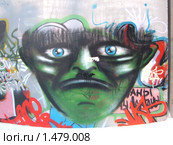Ядовито - зелёное лицо с голубыми глазами. Граффити. (2010 год). Редакционное фото, фотограф Денис Кравченко / Фотобанк Лори