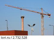 Гнездо аистов на заводской трубе (2010 год). Редакционное фото, фотограф Юрий Синицын / Фотобанк Лори
