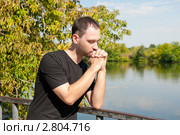 Огорченный молодой человек. Стоковое фото, фотограф E. O. / Фотобанк Лори