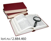 Стопка книг и лупа на белом фоне. Стоковое фото, фотограф Анна Зеленская / Фотобанк Лори