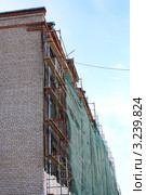 Леса под зеленой защитной сеткой (2012 год). Редакционное фото, фотограф Анатолий Матвейчук / Фотобанк Лори