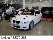BMW 3-й серии белого цвета в Крокус Экспо 2012. Редакционное фото, фотограф Глазков Владимир / Фотобанк Лори