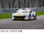 Автомобиль Megane Trophy V6 участвует в чемпионате "Мировая серия Renault" на трассе"Moscow Raceway" в Подмосковье (2012 год). Редакционное фото, фотограф Николай Винокуров / Фотобанк Лори