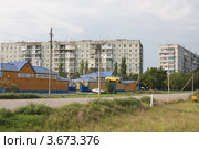 Город Нефтекумск. Автомагазин и жилые панельные дома (2012 год). Редакционное фото, фотограф Андрей Ижаковский / Фотобанк Лори