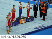 Чемпионат Европы по спортивной гимнастике 2013 года. Москва, СК "Олимпийский". Награждение победителей состязаний на перекладине - Эмин Гарибов, Сэм Олдэм (Sam Oldham) и Александр Царевич. Редакционное фото, фотограф Игорь Долгов / Фотобанк Лори