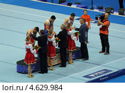 Чемпионат Европы по спортивной гимнастике 2013 года. Москва, СК "Олимпийский". Награждение победителей состязаний на перекладине - Эмин Гарибов, Сэм Олдэм (Sam Oldham) и Александр Царевич. Редакционное фото, фотограф Игорь Долгов / Фотобанк Лори