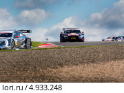 Автомобиль Audi RS 5 DTM команды Audi Sport Team Abt Sportsline участвует в гоночной серии кузовных автомобилей Deutsche Tourenwagen Masters на трассе Moscow Raceway в Подмосковье 3 августа 2013. Редакционное фото, фотограф Николай Винокуров / Фотобанк Лори