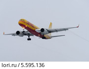 Ту-204С (бортовой RA-64024) авиакомпании DHL на посадке в Шереметьево (2014 год). Редакционное фото, фотограф Alexei Tavix / Фотобанк Лори