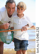 father and son fishing. Стоковое фото, фотограф Phovoir Images / Фотобанк Лори
