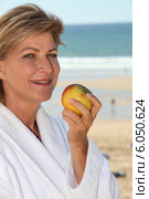 senior woman relaxing in a hotel near the beach. Стоковое фото, фотограф Phovoir Images / Фотобанк Лори