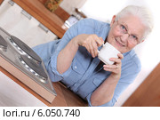 Woman enjoying a cup of tea. Стоковое фото, фотограф Phovoir Images / Фотобанк Лори