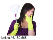 A maid with a feather duster. Стоковое фото, фотограф Phovoir Images / Фотобанк Лори