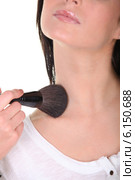 A woman applying blusher. Стоковое фото, фотограф Phovoir Images / Фотобанк Лори
