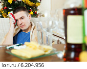Man having hangover after New year party. Стоковое фото, фотограф Яков Филимонов / Фотобанк Лори