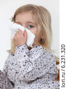 Girl blowing her nose. Стоковое фото, фотограф Phovoir Images / Фотобанк Лори