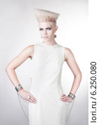futuristic blond woman in white dress with creative hairstyle. Стоковое фото, фотограф Александр Буц / Фотобанк Лори