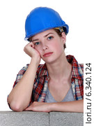 A bored tradeswoman. Стоковое фото, фотограф Phovoir Images / Фотобанк Лори