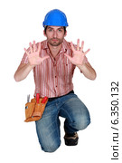 Tradesman holding up his hands. Стоковое фото, фотограф Phovoir Images / Фотобанк Лори
