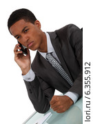 Displeased businessman slamming fist on desk. Стоковое фото, фотограф Phovoir Images / Фотобанк Лори