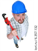 Builder with an adjustable wrench. Стоковое фото, фотограф Phovoir Images / Фотобанк Лори