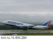 Взлет самолета  Boeing 747 авиакомпании "Трансаэро" (Transaero) (2014 год). Редакционное фото, фотограф Антон Афанасьев / Фотобанк Лори