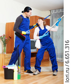 Playful cleaning premises team in uniform. Стоковое фото, фотограф Яков Филимонов / Фотобанк Лори