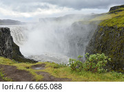 Водопад Деттифосс (исл. Dettifoss) на реке Йёкульсау-ау-Фьёдлум в дождливую погоду, Исландия (2014 год). Стоковое фото, фотограф Овчинникова Ирина / Фотобанк Лори