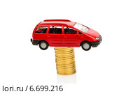 rising car costs. car on coins. Стоковое фото, фотограф Erwin Wodicka / Фотобанк Лори