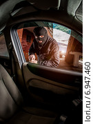 Car thief in a mask. Стоковое фото, фотограф Андрей Армягов / Фотобанк Лори