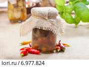 Glass jar of pickled mushrooms on jute table cloth. Autumn dish. Стоковое фото, агентство BE&W Photo / Фотобанк Лори