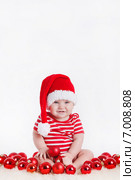 Baby with Christmas decoration on a white background. Стоковое фото, фотограф Александр Савченко / Фотобанк Лори