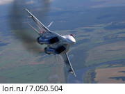 Вираж МиГ-29ОВТ с изменяемым вектором тяги полёт на фоне земли. Съёмка с воздуха. (2005 год). Редакционное фото, фотограф Михеев Алексей / Фотобанк Лори
