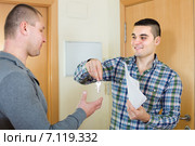 Two men at doorway with keys and contract. Стоковое фото, фотограф Яков Филимонов / Фотобанк Лори