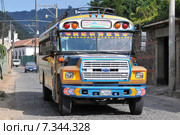 Chicken bus (Camioneta) colloquial name a colorful modified and decorated bus that transports goods and people between communities in Honduras and Guatemala.Guatemala, Antigua, typical colorful and decorated bus. Редакционное фото, агентство BE&W Photo / Фотобанк Лори