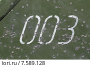 Следы от пуль и осколков на бронированном борту военной машины. Стоковое фото, фотограф Игорь Долгов / Фотобанк Лори