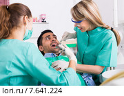 Dentist and scared patient. Стоковое фото, фотограф Яков Филимонов / Фотобанк Лори