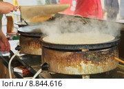 Cooking galettes or pancakes. Стоковое фото, фотограф pascal coupry / PantherMedia / Фотобанк Лори