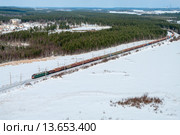 Товарный поезд среди заснеженных озер Карелии. Стоковое фото, фотограф Кекяляйнен Андрей / Фотобанк Лори