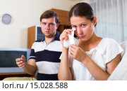 Man trying reconcile with wife in living room. Стоковое фото, фотограф Яков Филимонов / Фотобанк Лори