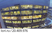 Employees on workplaces at evening in office building. View from unmanned quadrocopter (2013 год). Редакционное фото, фотограф Losevsky Pavel / Фотобанк Лори
