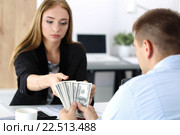 Женщина принимает пачку стодолларовых купюр. Продажность, взятка, коррупция. Стоковое фото, фотограф Людмила Дутко / Фотобанк Лори