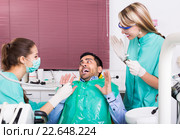 Terrified client in dental clinic. Стоковое фото, фотограф Яков Филимонов / Фотобанк Лори