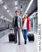 Portrait of young couple with wheeled trollers. Стоковое фото, фотограф Яков Филимонов / Фотобанк Лори