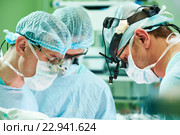 male cardiac surgeon at child cardiosurgery operating room. Стоковое фото, фотограф Дмитрий Калиновский / Фотобанк Лори