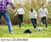Portrait of four friends posing on countryside field with ball. Стоковое фото, фотограф Яков Филимонов / Фотобанк Лори