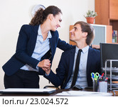 Top manager flirting with subordinate official at workplace. Стоковое фото, фотограф Яков Филимонов / Фотобанк Лори