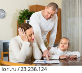 Sad family having financial problems. Стоковое фото, фотограф Яков Филимонов / Фотобанк Лори
