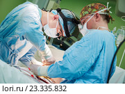 male cardiac surgeon at child cardiosurgery operating room. Стоковое фото, фотограф Дмитрий Калиновский / Фотобанк Лори