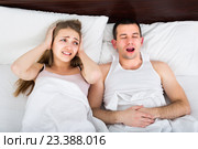 Young woman disturbed with partner snores. Стоковое фото, фотограф Яков Филимонов / Фотобанк Лори