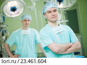 male cardiac surgeon at child cardiosurgery operating room. Стоковое фото, фотограф Дмитрий Калиновский / Фотобанк Лори